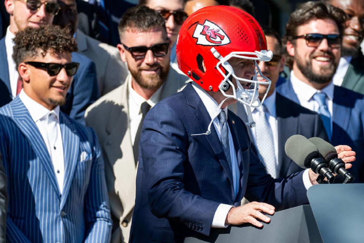 President Biden Hands the Mic to Travis Kelce at Chiefs’ Super Bowl Celebration Event