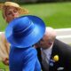 Queen Camilla's wide-brimmed hat obstructs Zara and Mike Tindall as they attempt to greet her with a kiss at Royal Ascot.