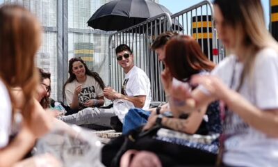 Taylormania hits Wembley! Fans start queuing for Taylor Swift's first London Eras Tour concert a day early (and make each other friendship bracelets to pass the time)