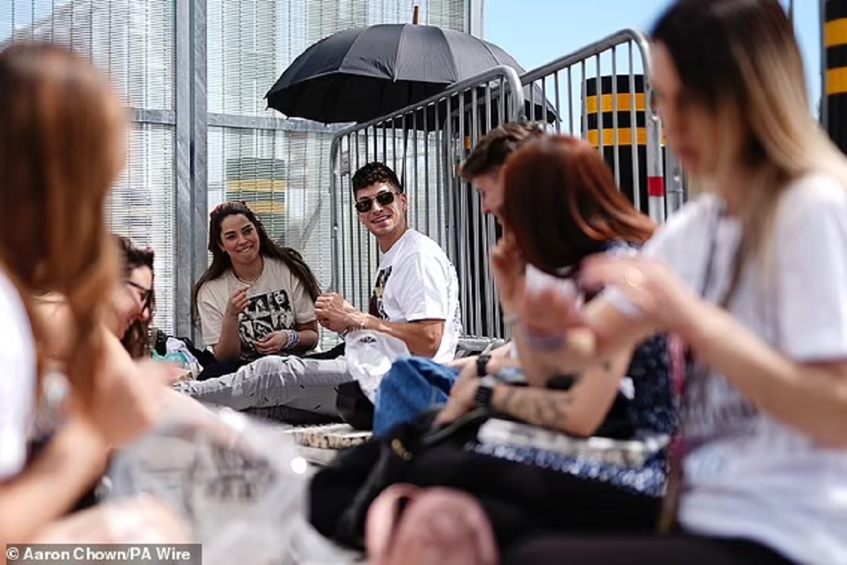 Taylormania hits Wembley! Fans start queuing for Taylor Swift's first London Eras Tour concert a day early (and make each other friendship bracelets to pass the time)