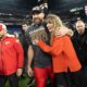 Taylor Swift is seen laughing joyfully over a lyric mentioning 'dating the boy on the football team', sparking speculation amid her rumored romance with Travis Kelce.