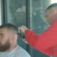 Travis Kelce's barber reflects on the controversy surrounding the Chiefs star's hairstyle.